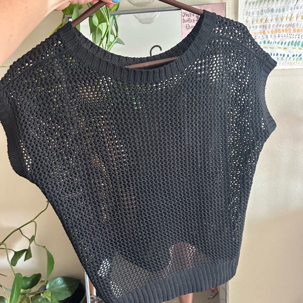 Rosette black netted shirt.